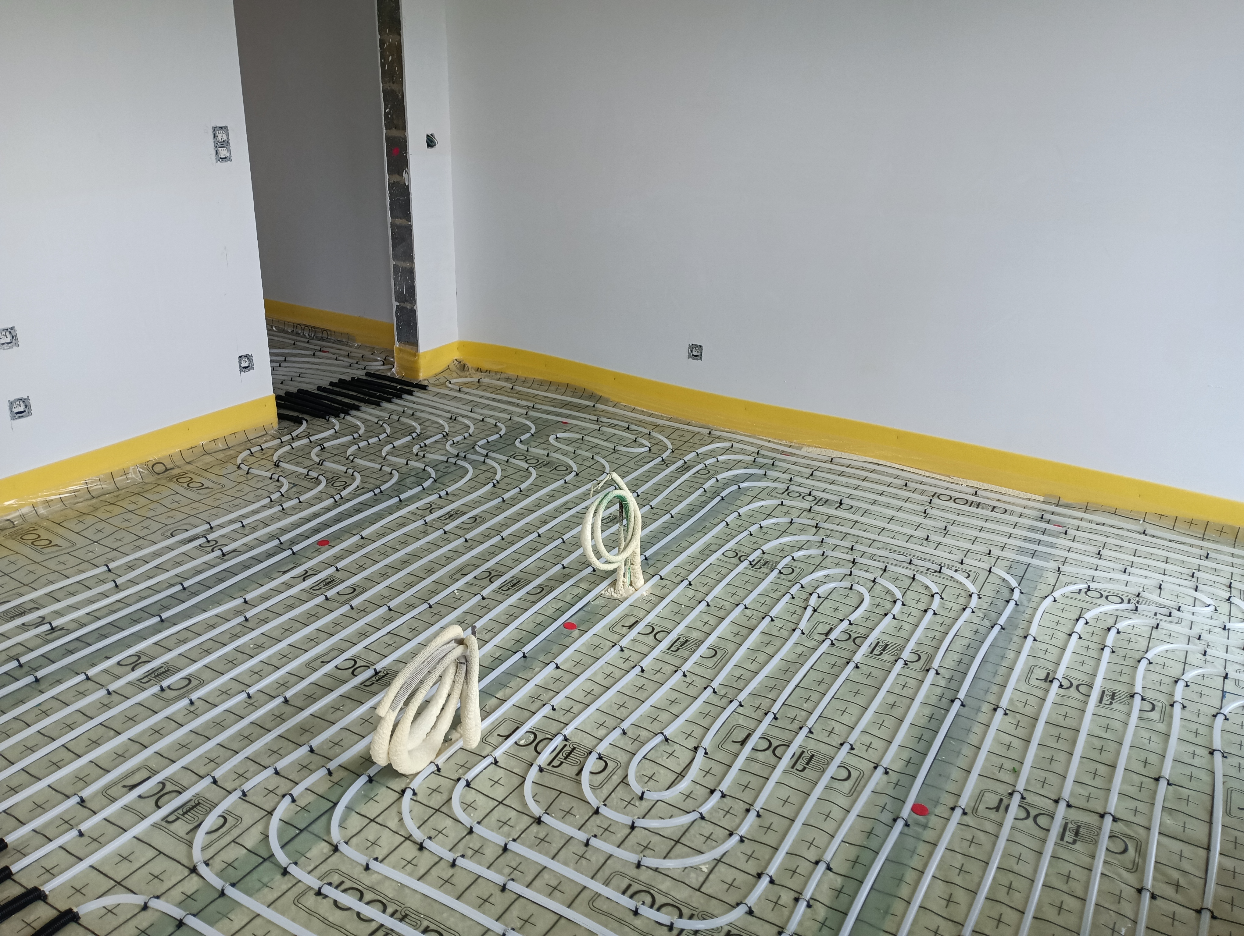 Installation d'un chauffage sol dans deux nouvelles constructions à Thimister